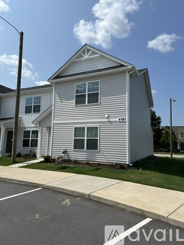 A two-story house with the number 4101 on the front.