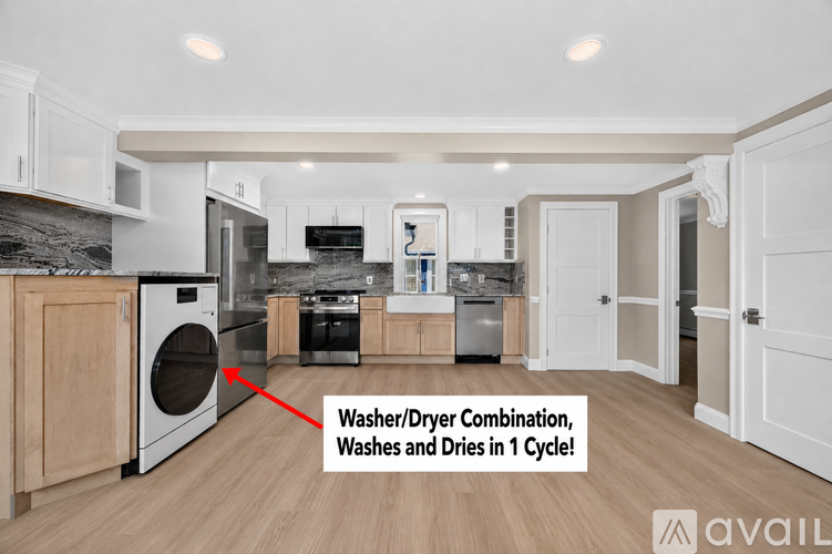 A modern kitchen with a washer and dryer combination unit.