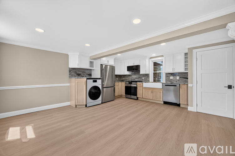 A kitchen with a washer and dryer built in.