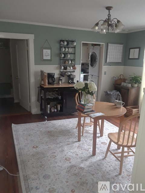 A kitchen with a table and chairs in the middle of the room.