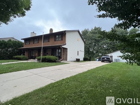 A house with a white garage door is for sale.