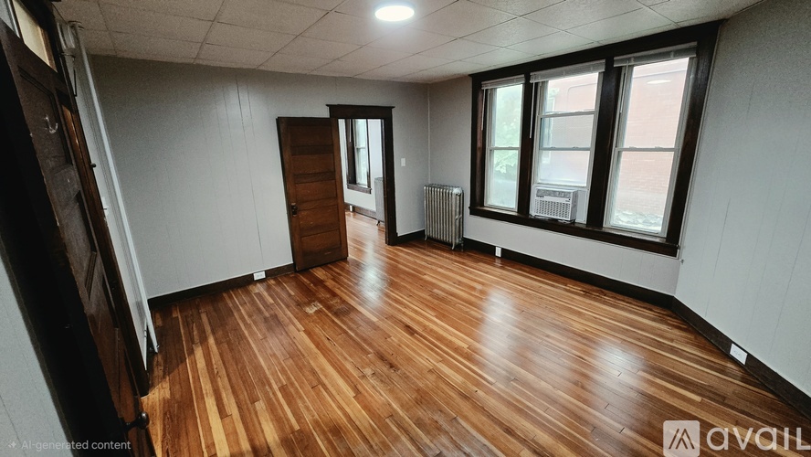 A room with wooden floors and white walls.