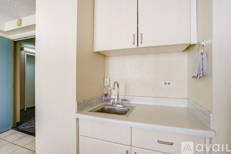 A kitchen with a sink and cabinets.