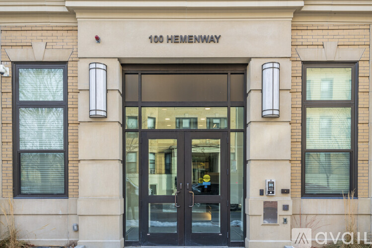The front of a building with the address 100 Menway.