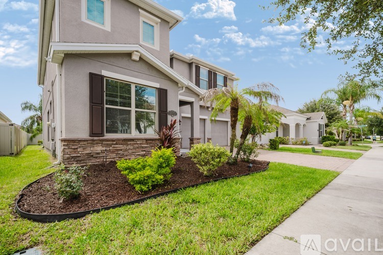 A house with a well-maintained front yard and landscaping.
