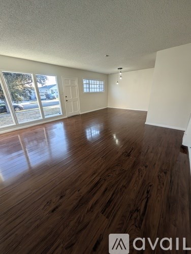 A room with wooden walls and a window.