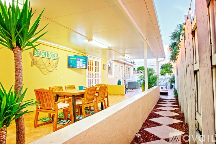 A dining area with a sign that says Beach House.