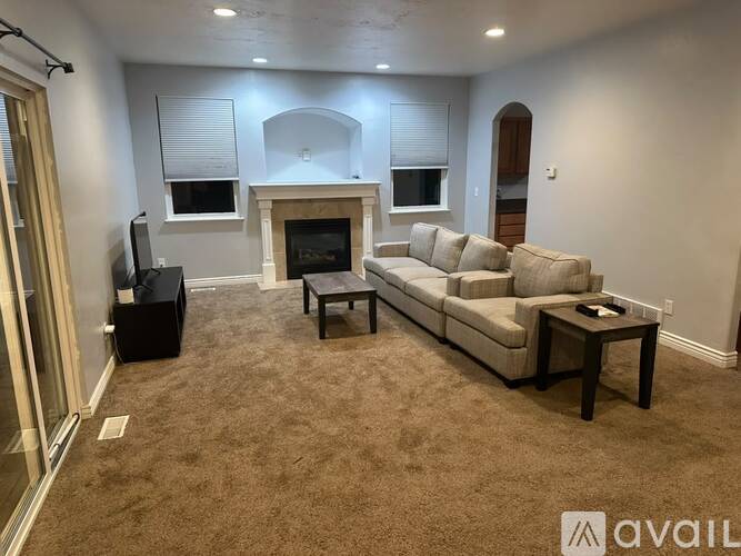 A living room with a fireplace and a couch.