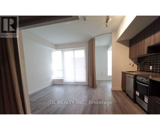 A kitchen area with a stove top oven and microwave.