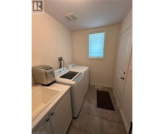 A laundry room with a washer and dryer.