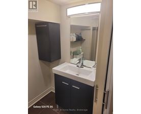 A bathroom with a sink and a mirror.