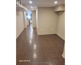 A hallway with Galaxy S20FE 5G phone in the corner.