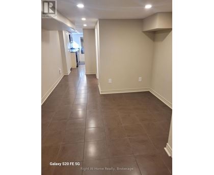 A hallway with Galaxy S20FE 5G phone in the corner.