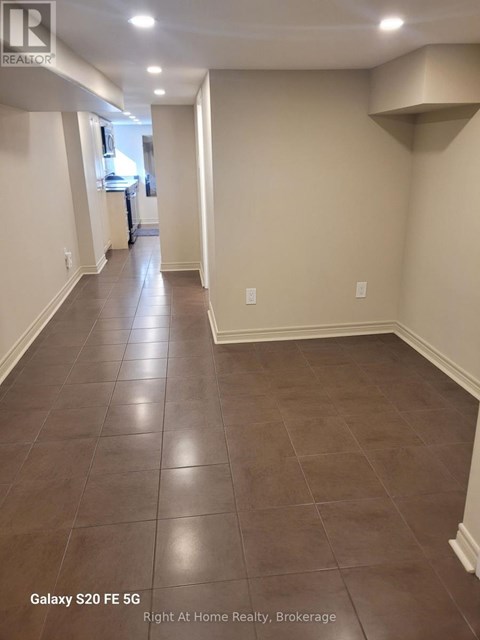 A hallway with Galaxy S20FE 5G phone in the corner.