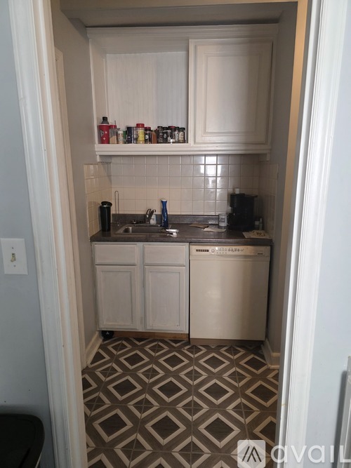 A small kitchen with a dishwasher and a sink.