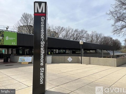 Grosvenor Street Station is a train station with a black sign.
