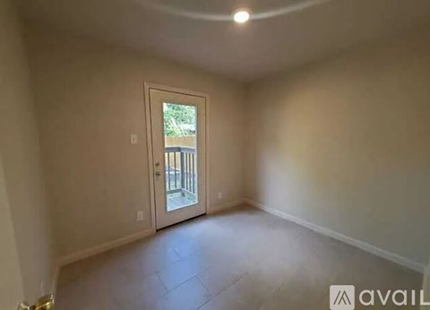 A room with a door leading outside.
