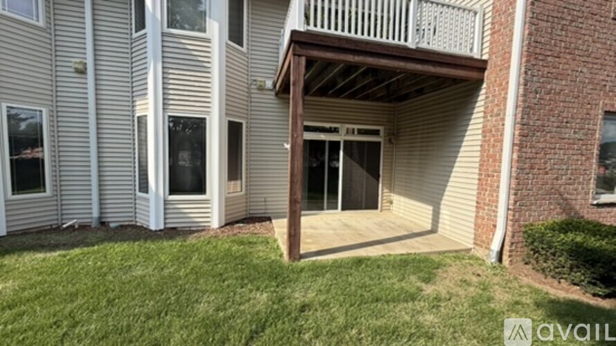 A building with a balcony and a window is available for rent.