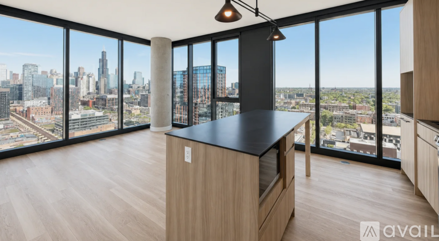 A modern kitchen with a view of the city skyline.