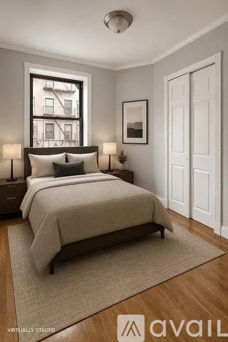 A bedroom with a bed, two lamps, a window, and a door.