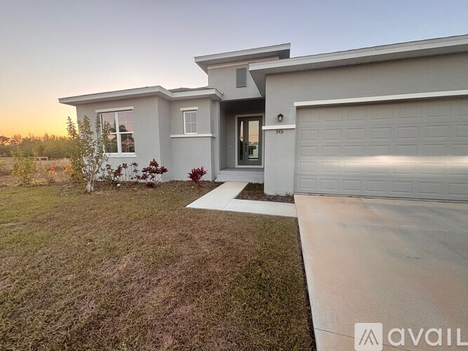 A modern house with a garage is available for sale.