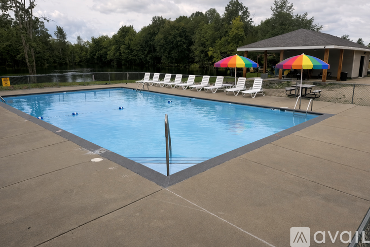 A pool with a brownish floor and a blueish water.