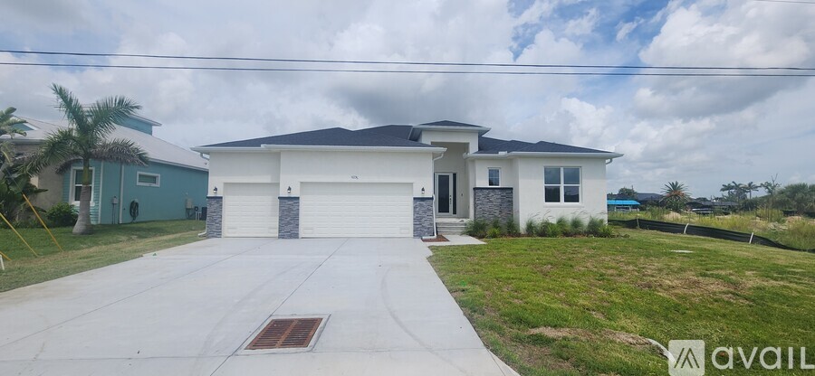 A two-story house with a garage is for sale.
