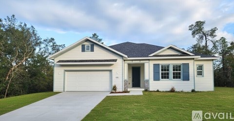 A two-story house with a garage is available for purchase.