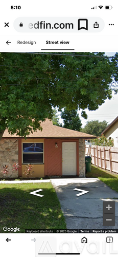 A small house with a brown roof and a white door is visible.