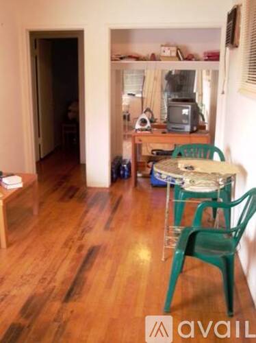 A room with a table and chairs in it.