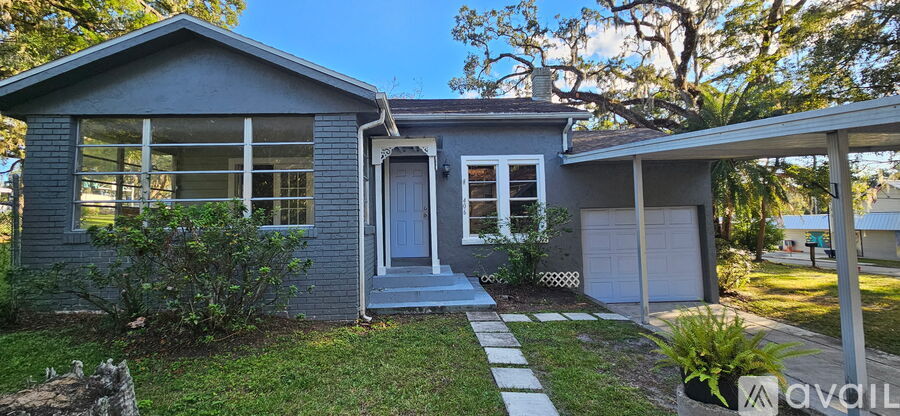 A small house with a garage is for sale.