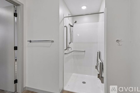 A white bathroom with a walk-in shower.