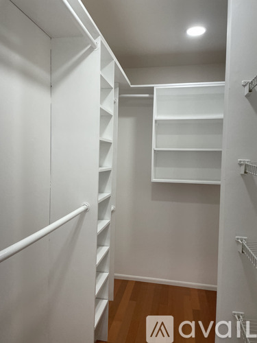 A white staircase with a wooden floor.
