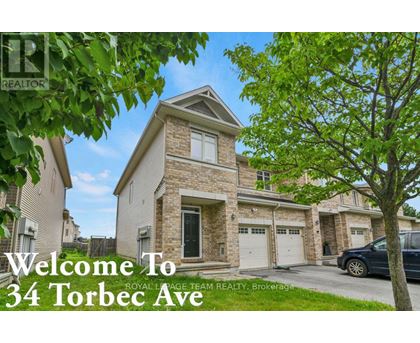 A house with the text "Welcome To 34 Torbec Ave" in front of it.