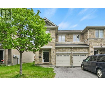 A large house with a tree in front and a car parked in front.