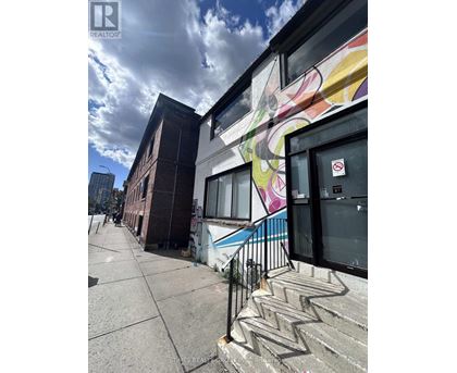 A building with a colorful mural on the side.