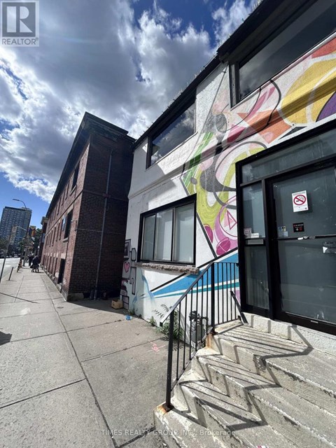 A building with a colorful mural on the side.