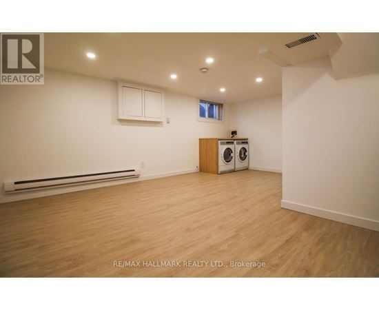 A room with a washer and dryer in it.