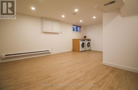 A room with a washer and dryer in it.