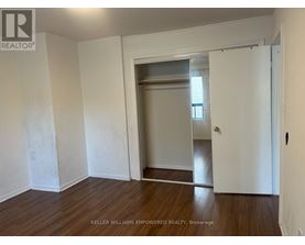 A room with a doorway leading to another room.