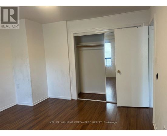 A room with a doorway leading to another room.