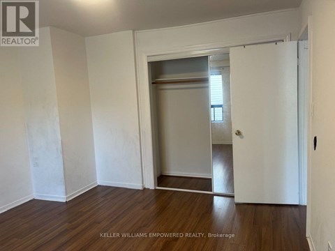 A room with a doorway leading to another room.