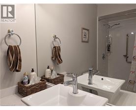 A bathroom with two sinks and a mirror.