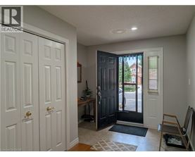 A room with a white door and a black door.