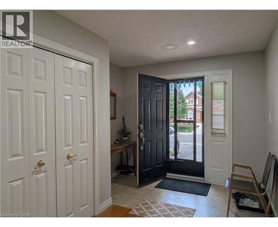 A room with a white door and a black door.
