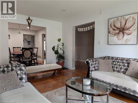 A living room with a couch, a chair, and a coffee table.