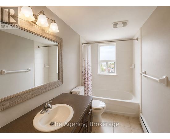 A bathroom with a sink, toilet, and bathtub.