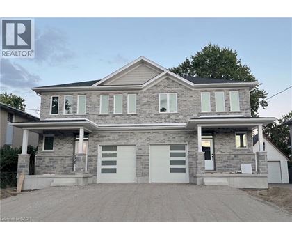 A two-story house with a garage is for sale.