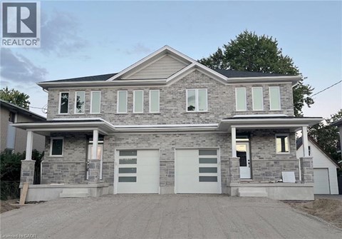 A two-story house with a garage is for sale.