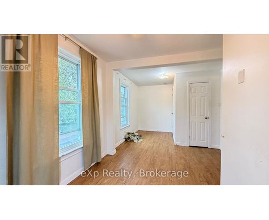 A room with a window and a door is shown in the image.